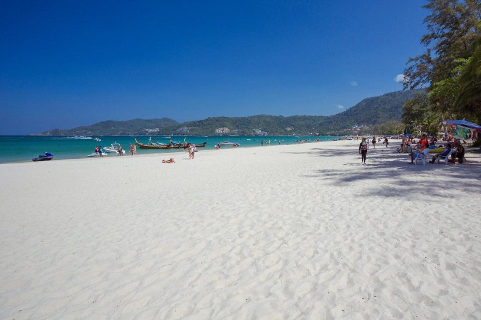 Patong Beach with many people and boats