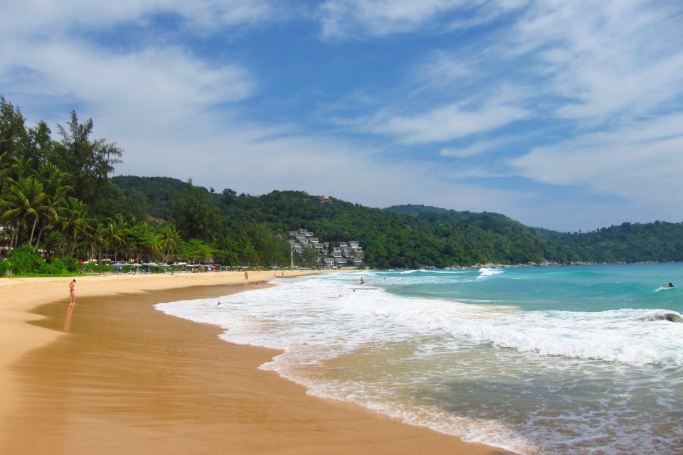 Kata Noi Beach with clear water and lush hills