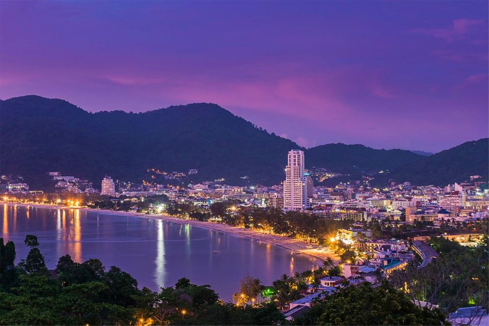 View of Patong Beach with hotels and palm trees