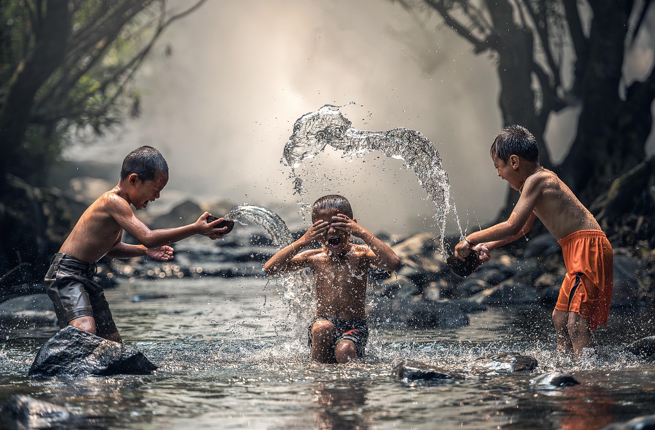 Children in the shallows of a tropical beach