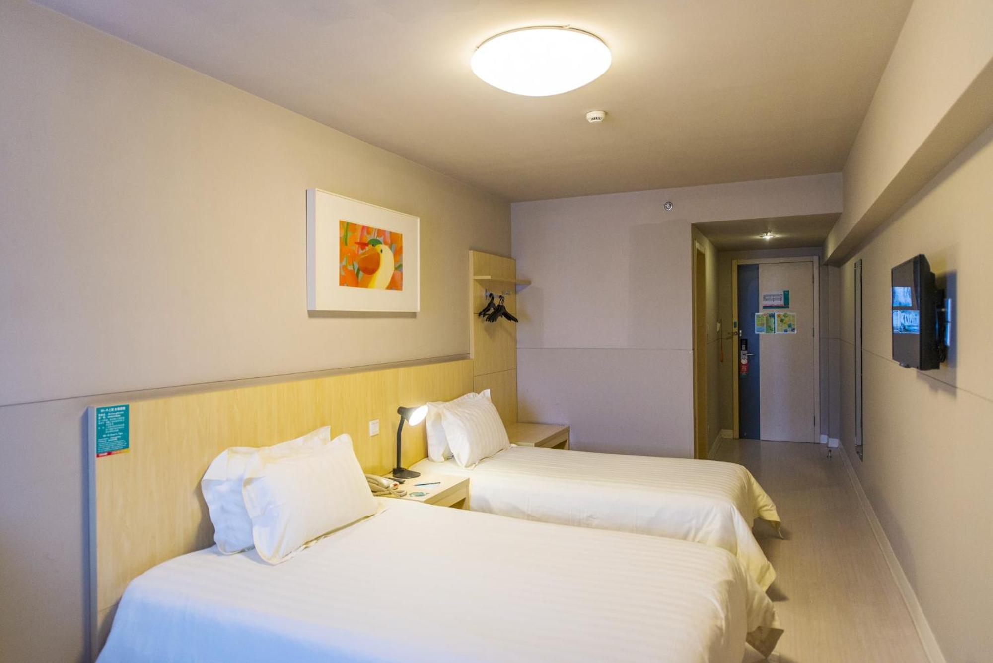 A compact, clean bathroom with a shower and basic amenities.