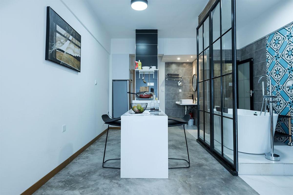 A modern apartment building with a sleek design and balconies.
