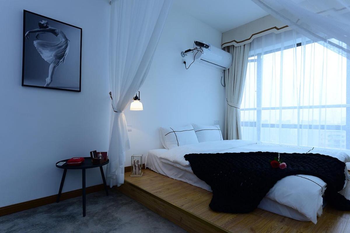 A bright bedroom with a comfortable bed and modern decor.